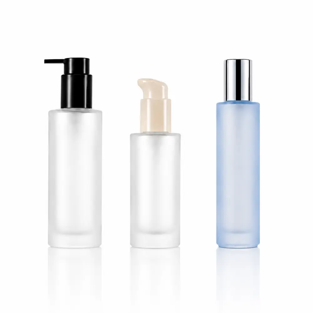 Custom lotion glass bottles with cosmetic pump dispensers