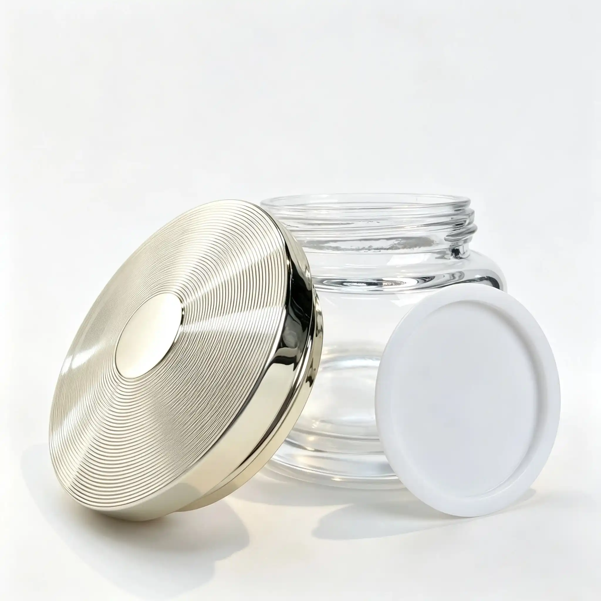 100g Glass Face Cream Jar and Cap 100g glass face cream jar displayed with its separate matching cap for packaging component evaluation.