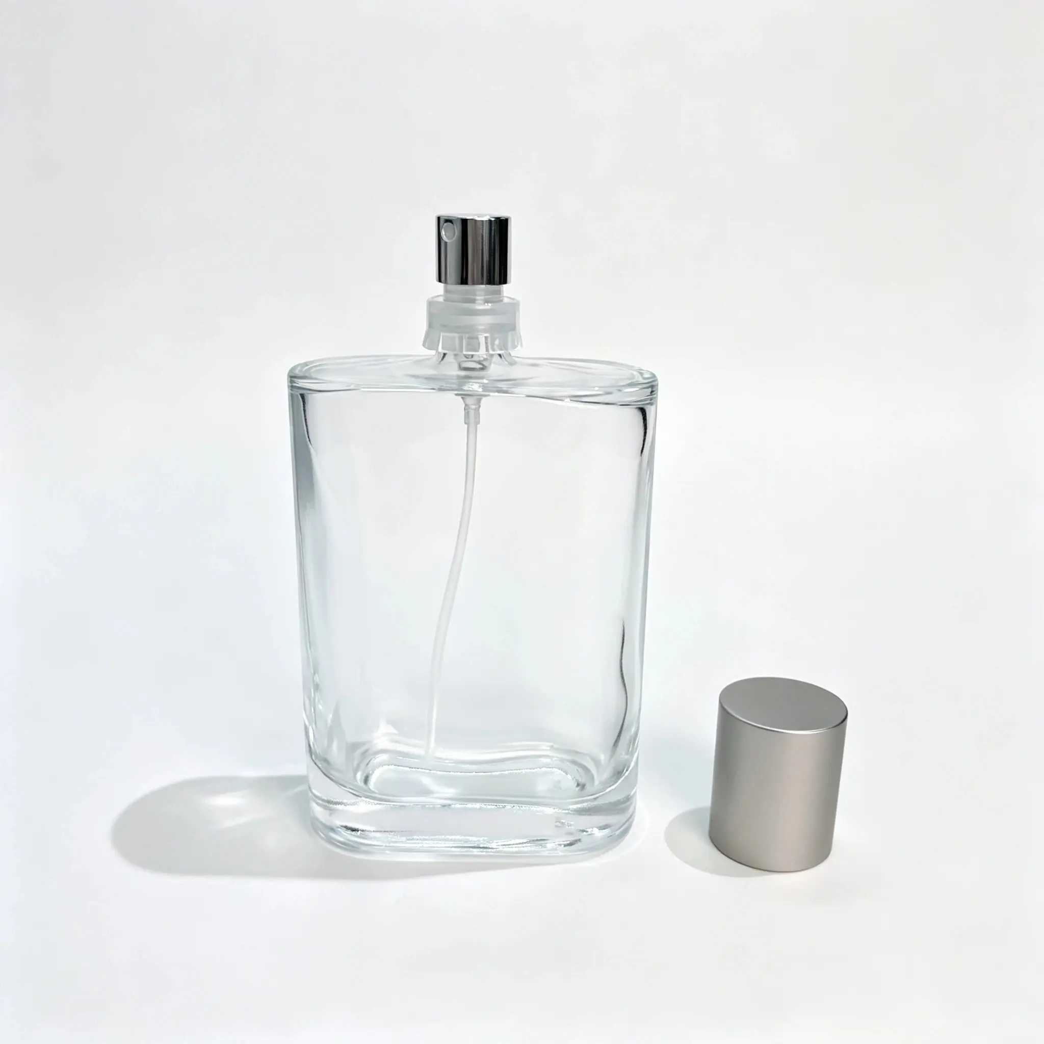 100ml custom rectangular perfume bottle shown without the outer cap with the cap displayed separately