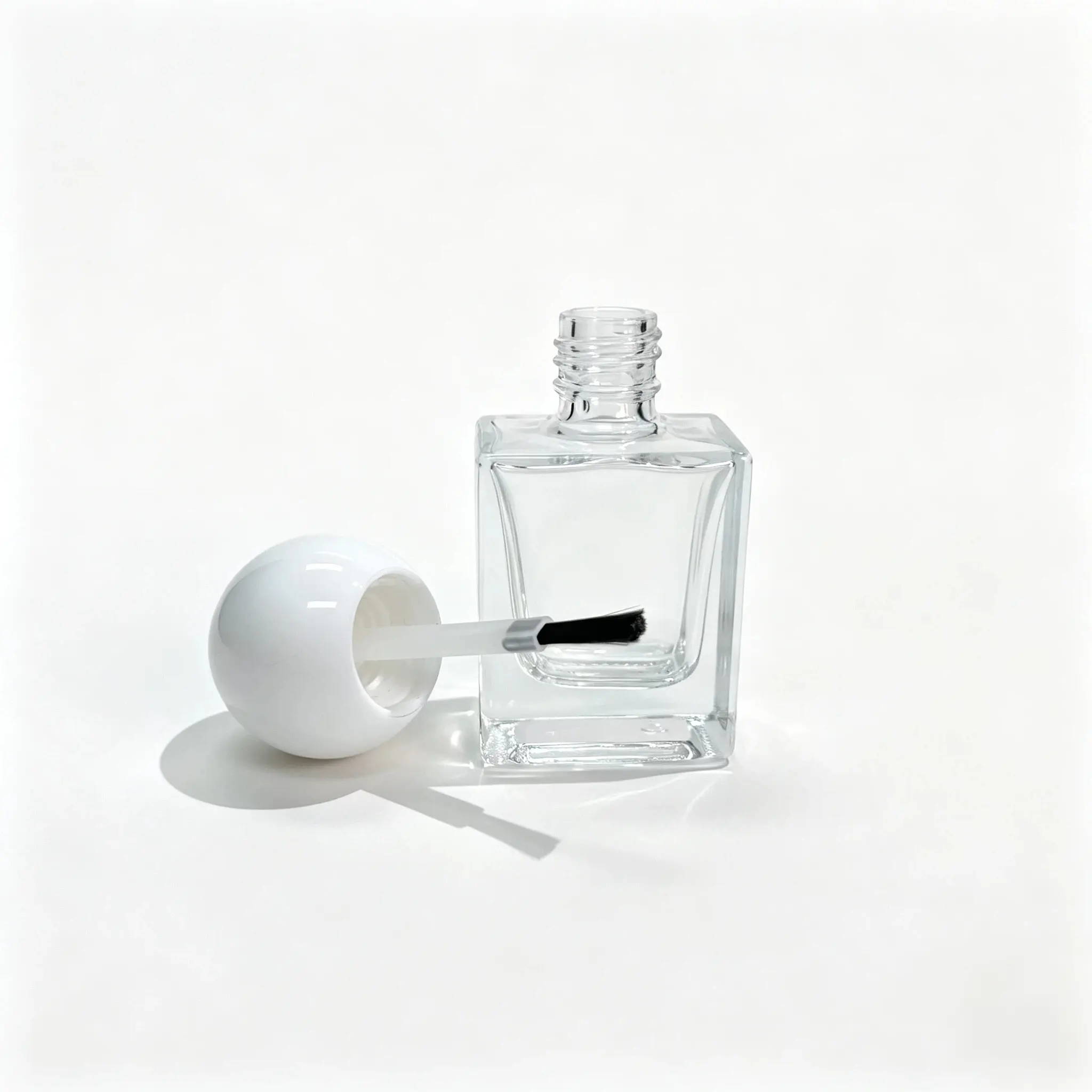 10ml custom nail polish bottle displayed together with its matching cap and brush components