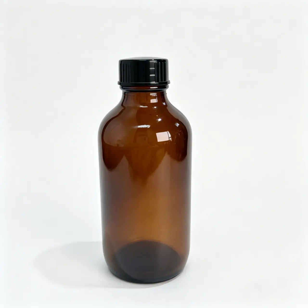 120ml-Amber-Boston-Round-Bottle-Front-View 120ml amber Boston round bottle with black screw cap shown from the front