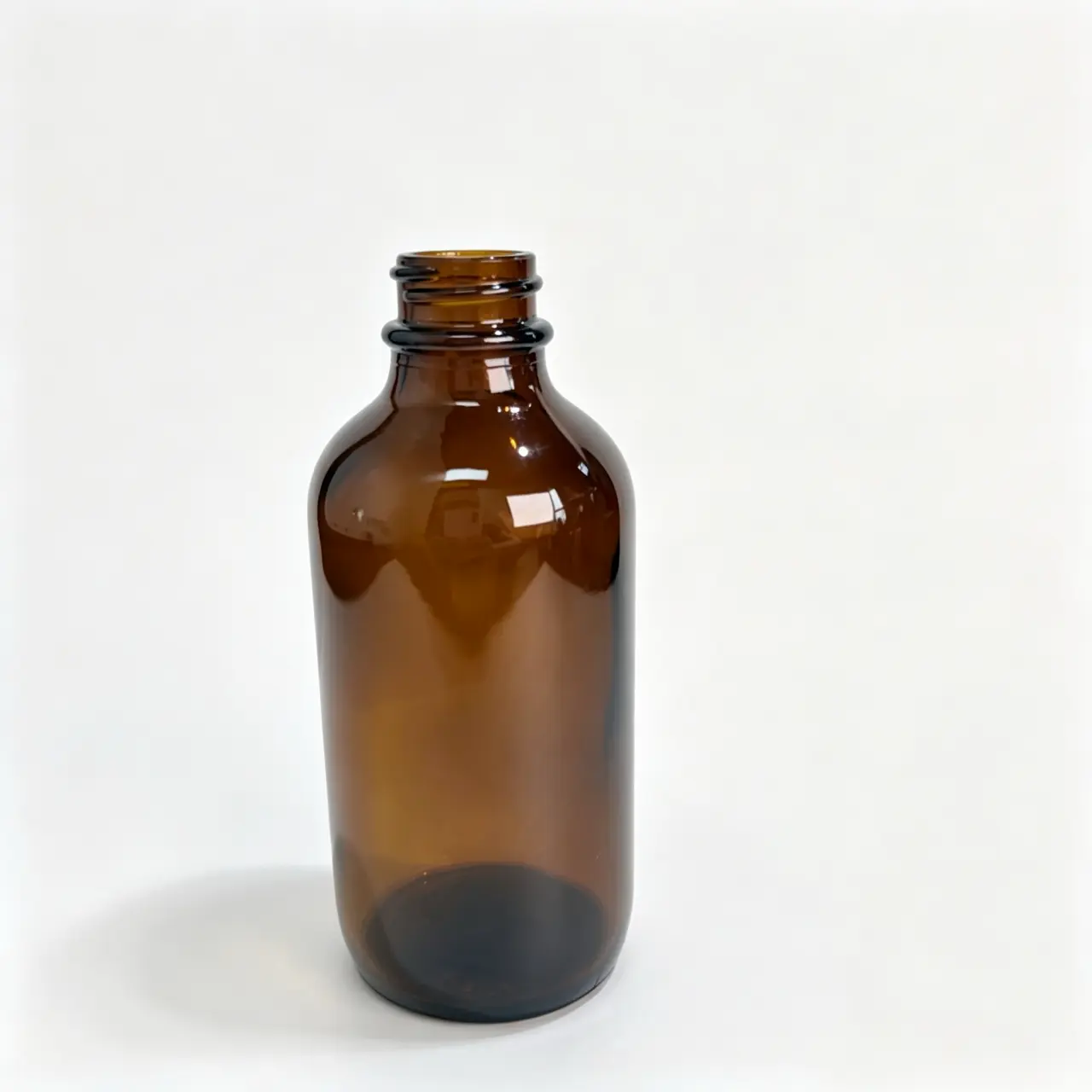 120ml-Amber-Boston-Round-Bottle-Without-Cap 120ml amber Boston round bottle shown without the closure in a front bare-bottle view