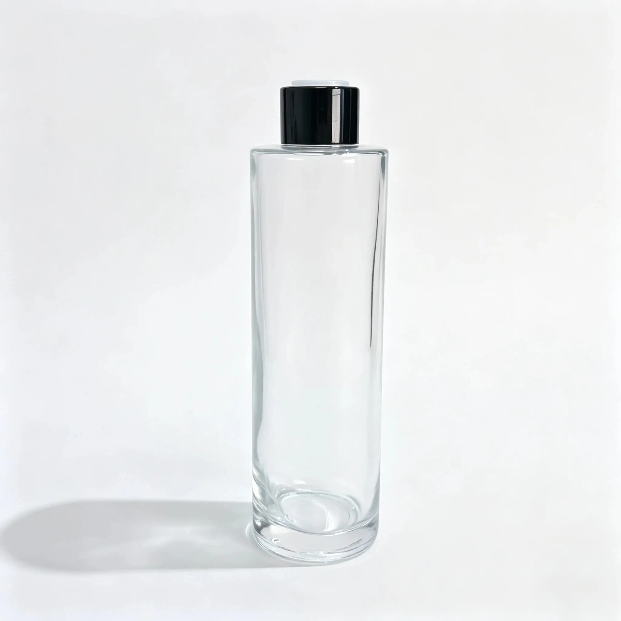 Front view of the complete 150ml glass facial toner bottle with matching closure