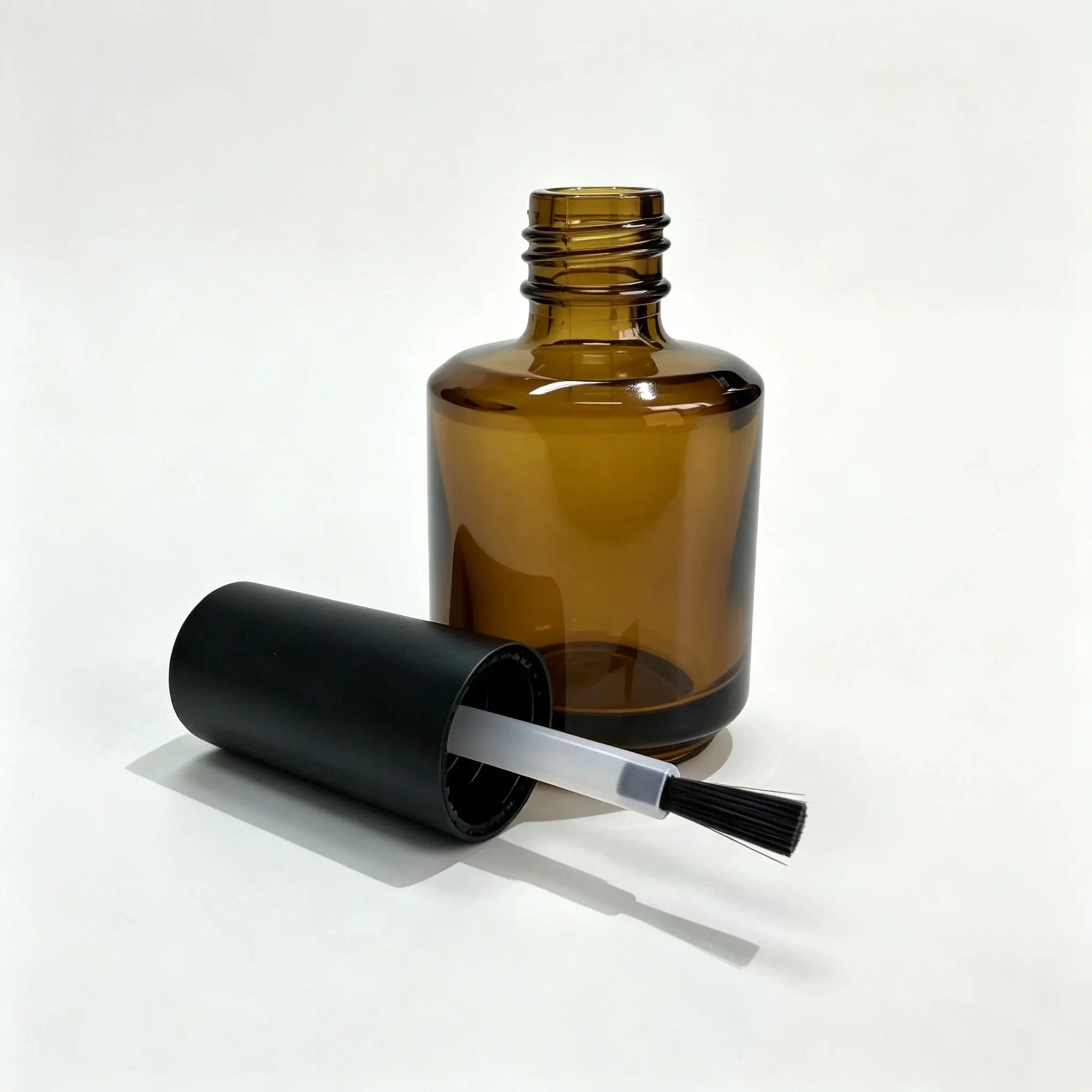 15ml Nail Polish Bottle with Cap and Brush 15ml nail polish bottle displayed with its matching cap and brush components for packaging evaluation
