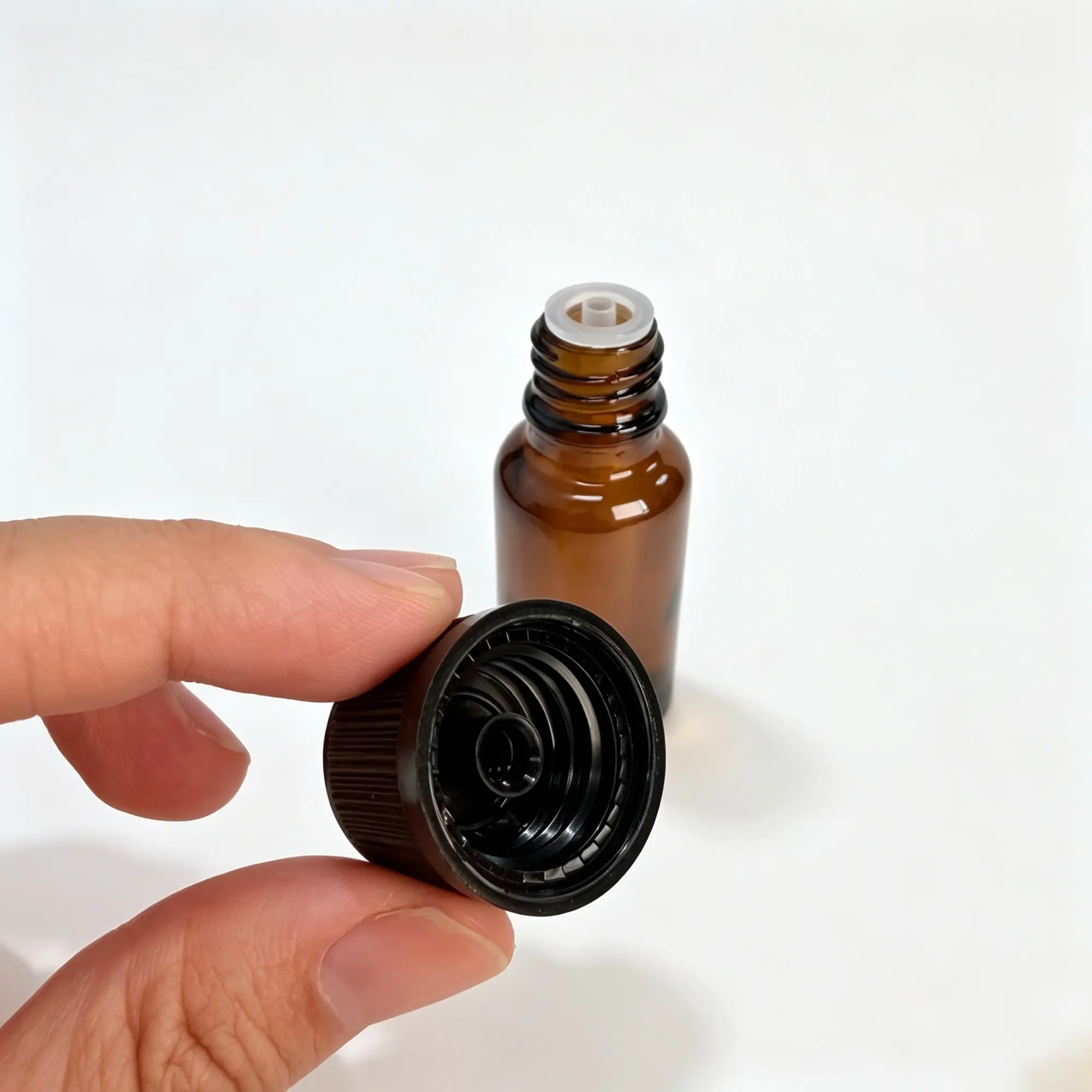 Close-up detail of the black cap supplied for the 20ml Euro dropper essential oil bottle