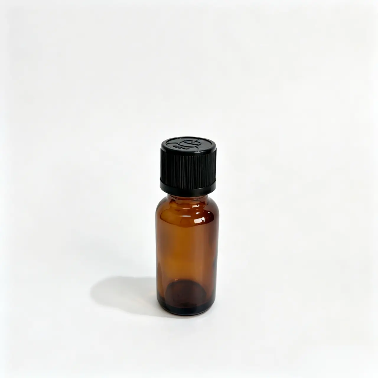 Front view of the 20ml Euro dropper essential oil bottle assembled with a black screw cap