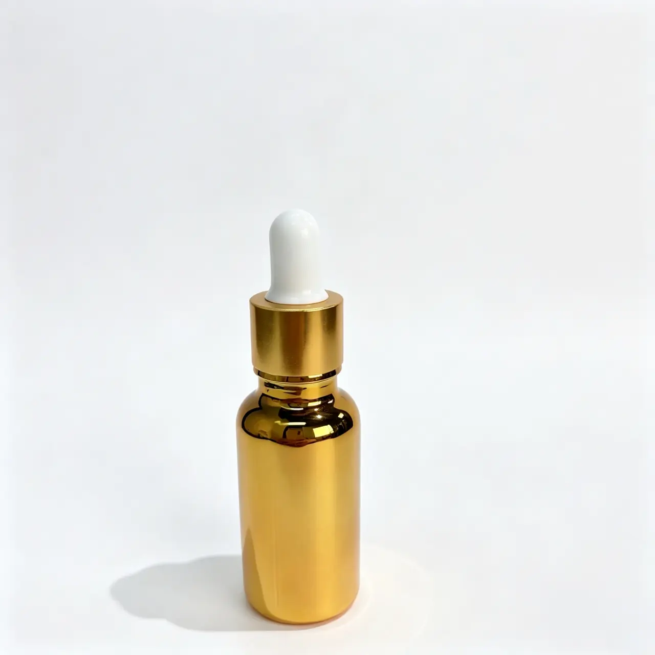 20ml gold Boston round dropper bottle shown upright from the front