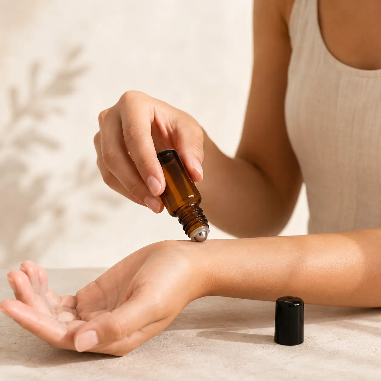 20ml Amber Glass Roll On Perfume Bottle Hand Application Scene 20ml amber glass empty roll on perfume bottle being applied by hand with the roller ball exposed for direct use