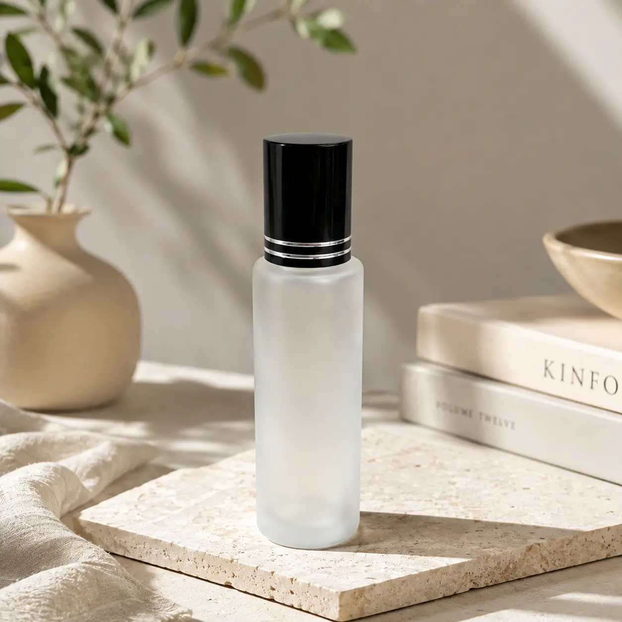 20ml Frosted Glass Roll On Perfume Bottle Flower Vase Scene 20ml frosted glass roller bottle displayed beside a flower vase showing its proportions and frosted finish