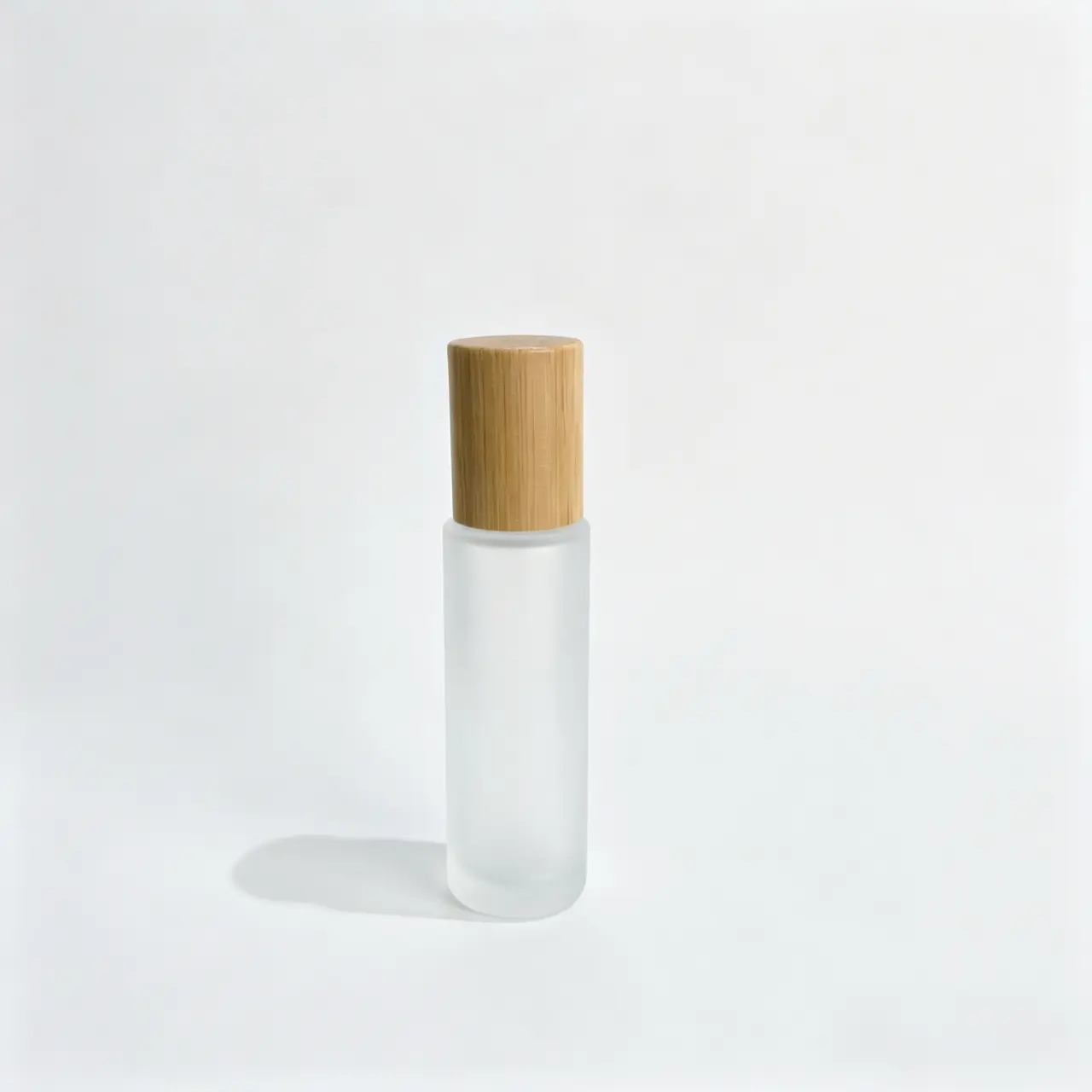 20ml Frosted Glass Roll On Perfume Bottle Wooden Cap Front View 20ml frosted glass roll on perfume bottle shown upright with a wooden cap and slim cylindrical profile