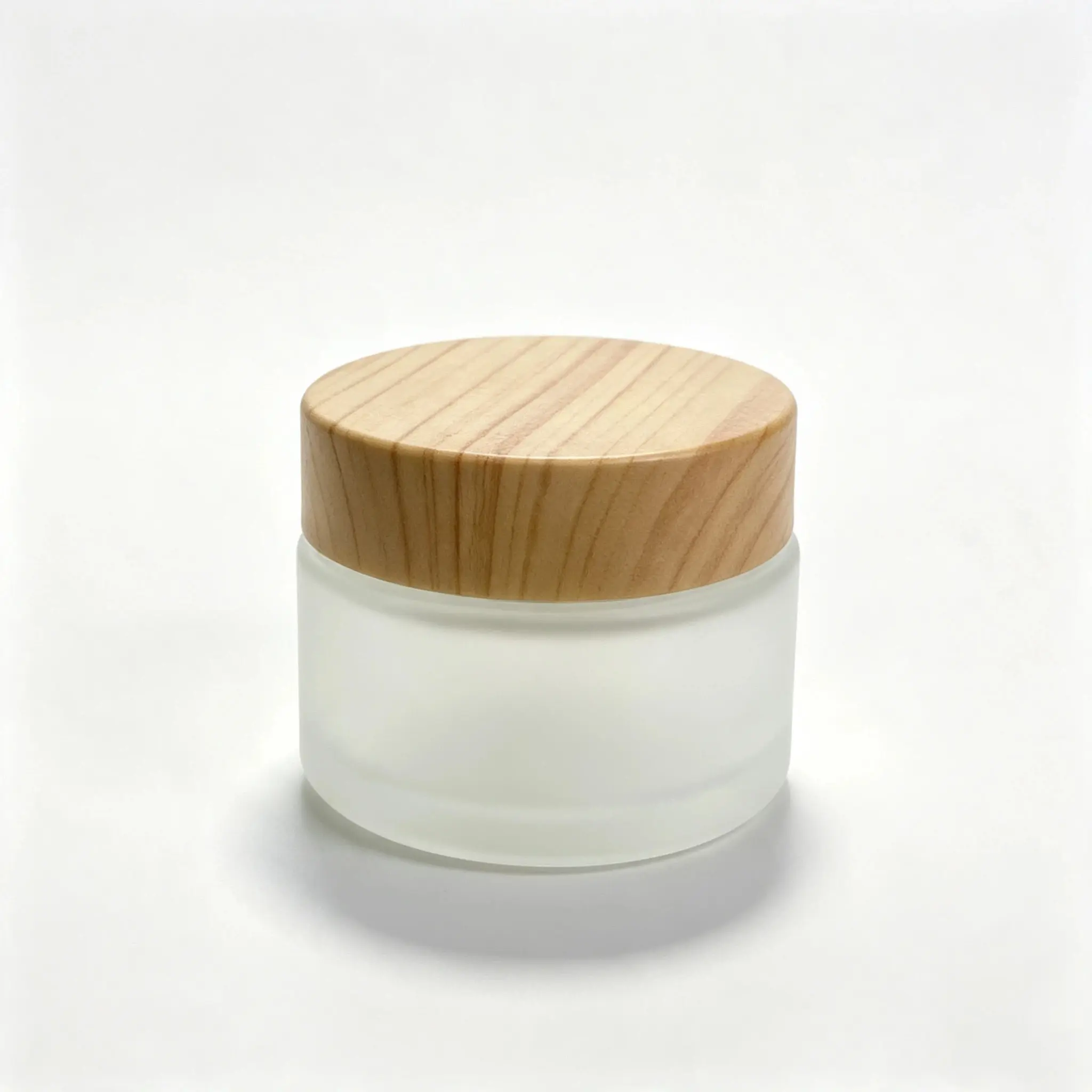 Front view of the complete 30g frosted glass cosmetic cream jar with matching cap