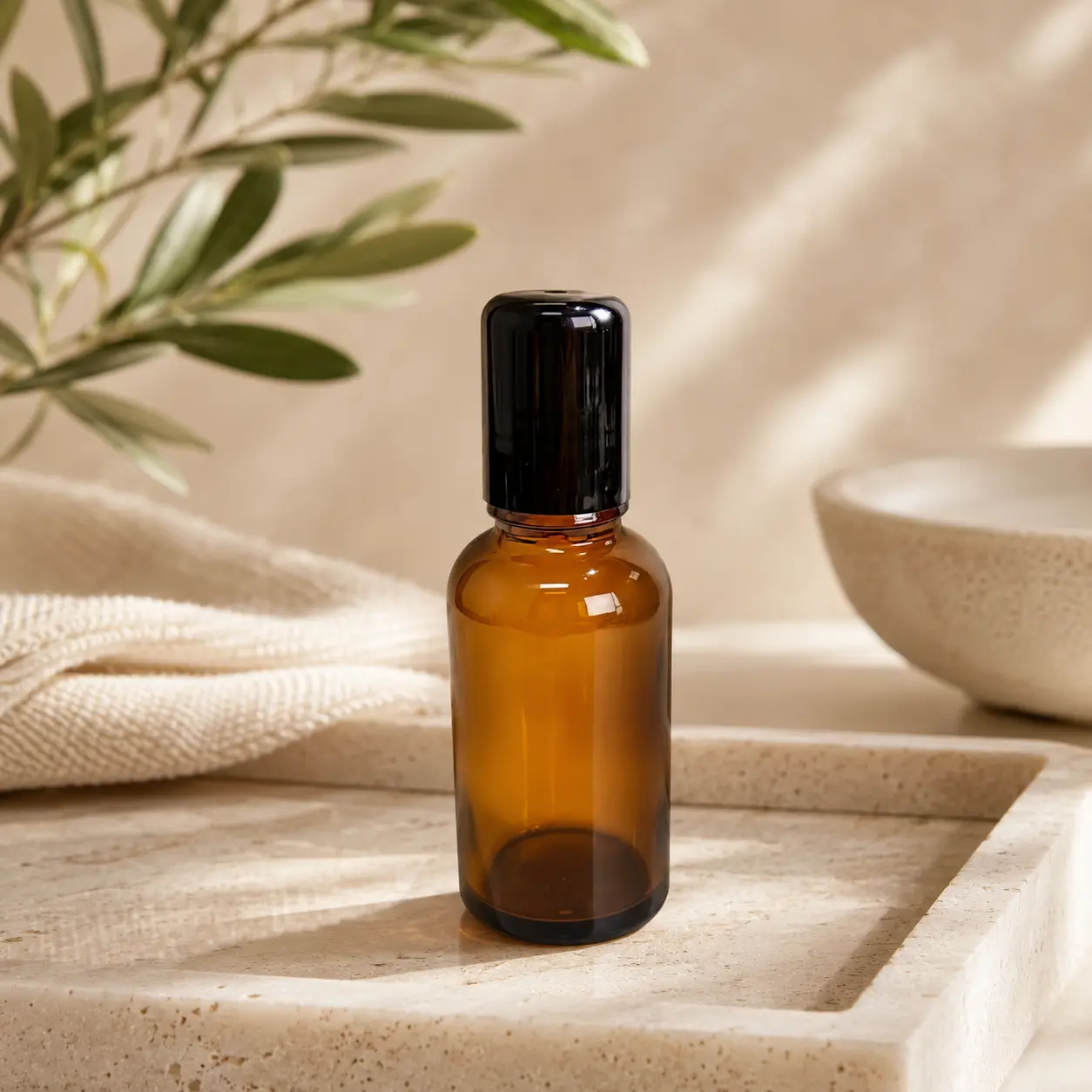 30ml Amber Glass Roll On Perfume Bottle Tray Scene 30ml amber glass essential oil roller bottle displayed on a tray in a styled packaging scene