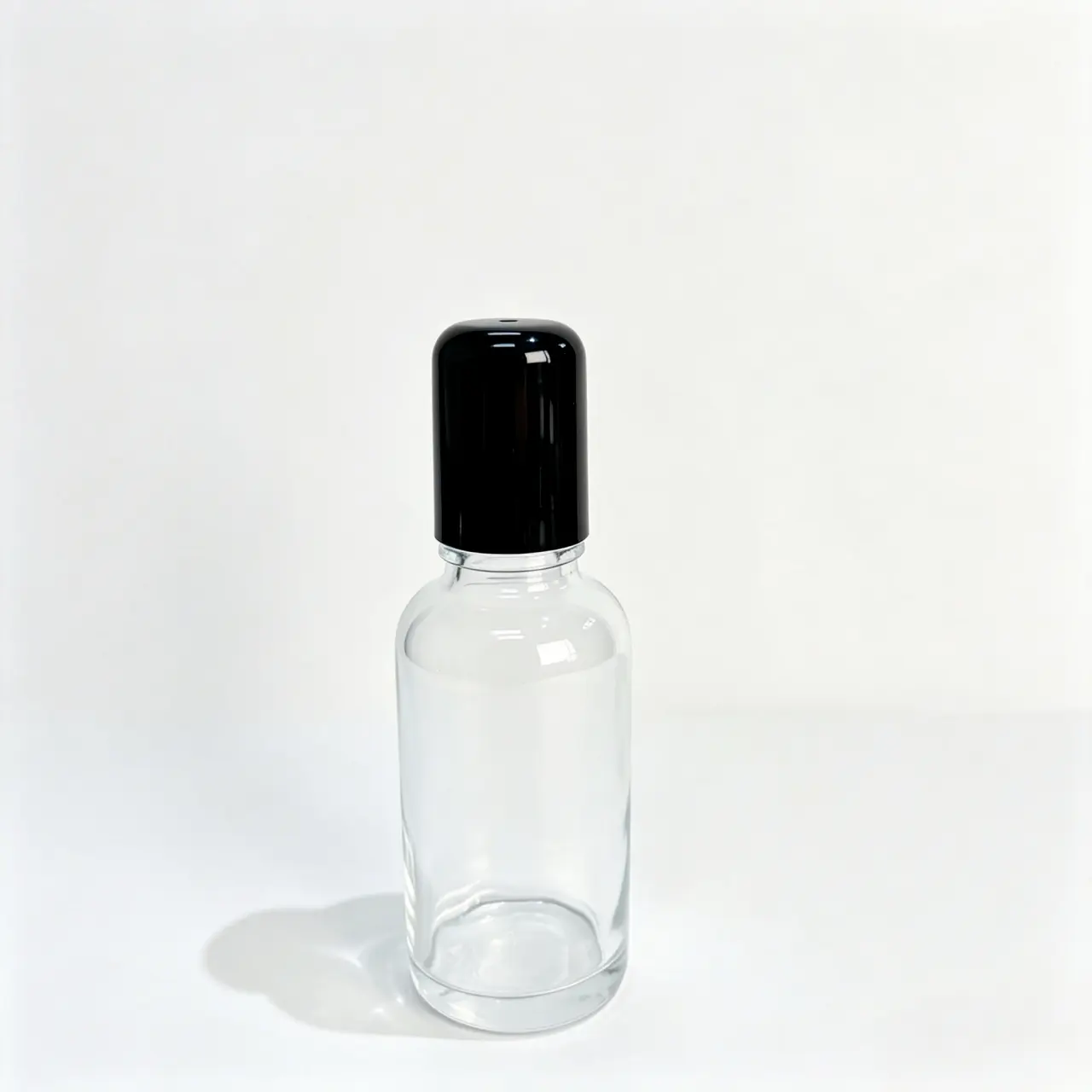 30ml Clear Glass Empty Rollerball Perfume Bottle Front View 30ml clear glass empty rollerball perfume bottle shown upright with matching cap and cylindrical bottle profile