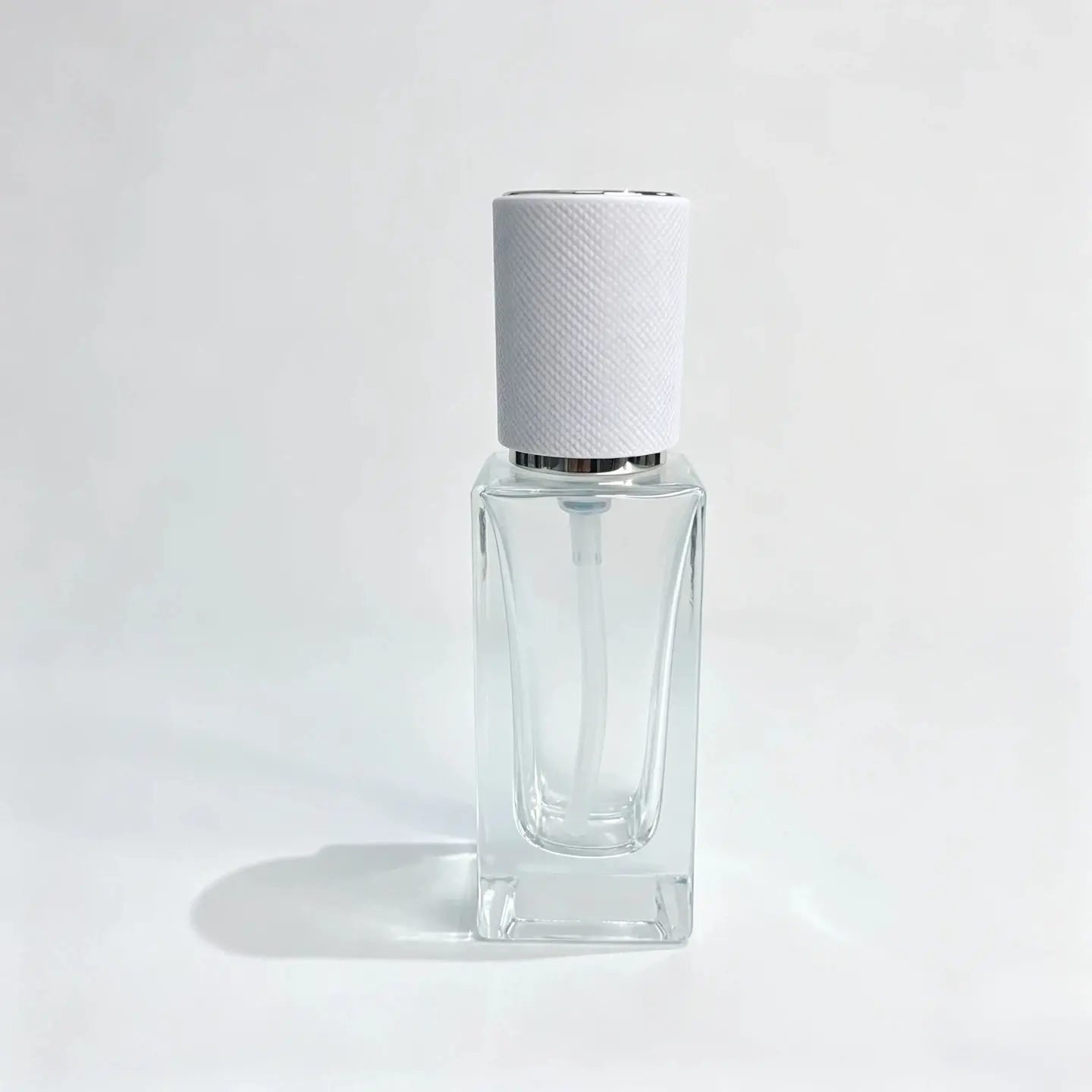 50ml Clear Glass Lotion Bottle Front View Front view of the 50ml clear glass lotion bottle assembled with its pump collar and cap