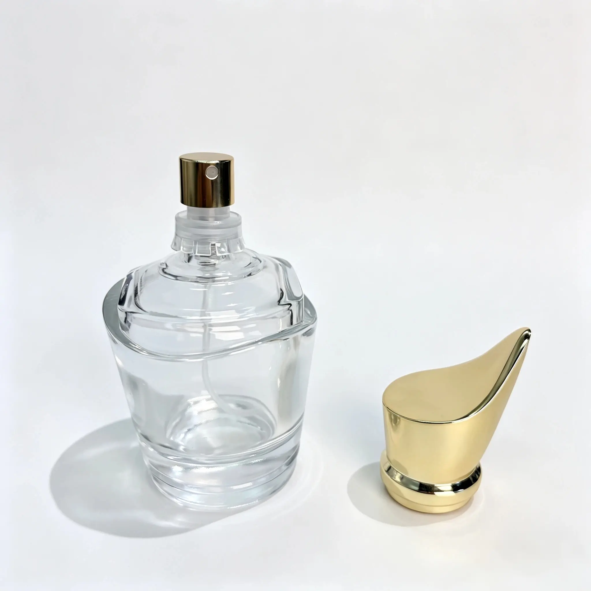50ml Teardrop Glass Perfume Bottle with Separate Cap 50ml teardrop glass perfume bottle shown bare with the outer cap positioned separately beside the bottle