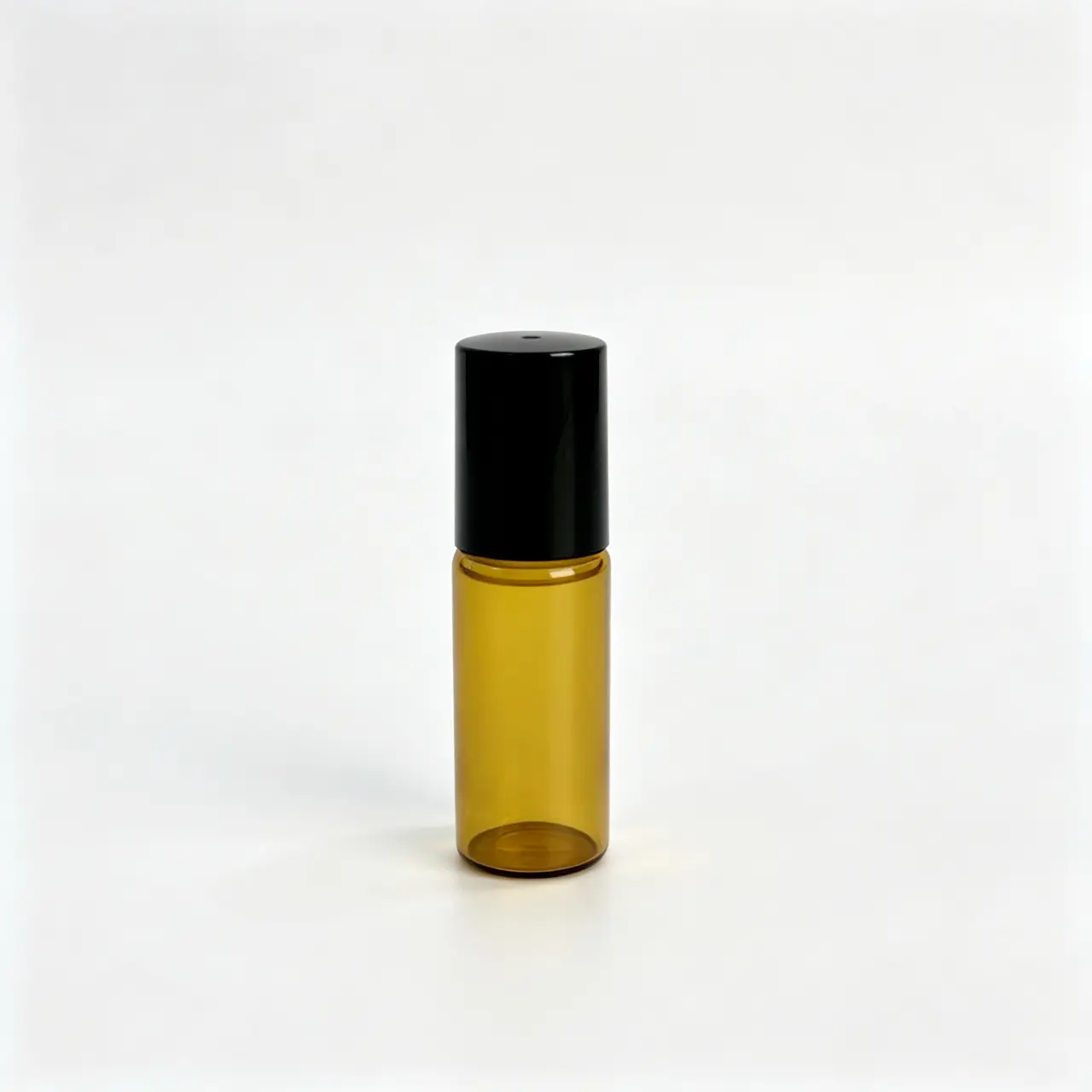 5ml Amber Roll On Bottle Front View 5ml amber roll on bottle shown upright with stainless steel roller assembly and matching cap
