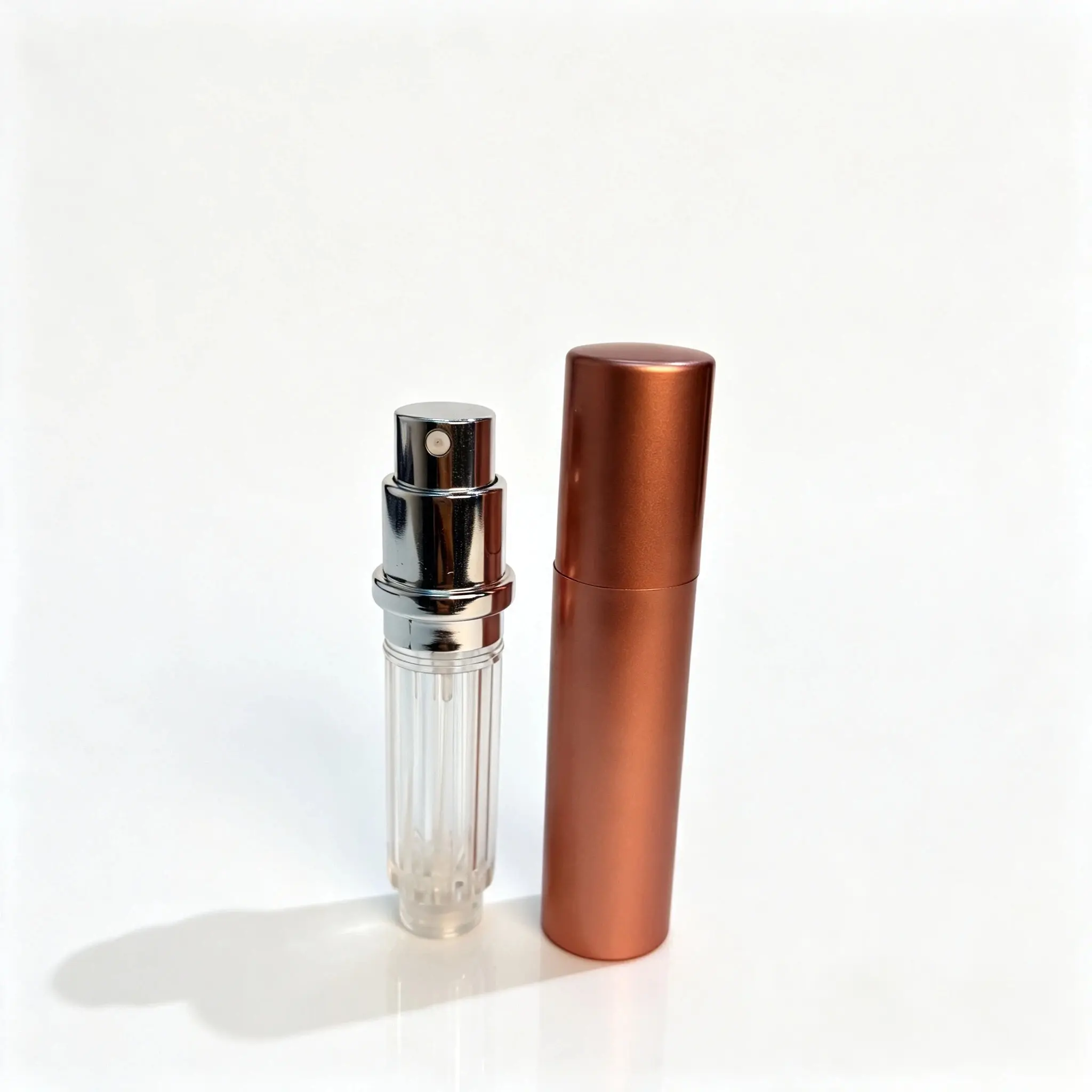 5ml Bottom Fill Perfume Atomizer Inner Bottle and Outer Shell 5ml bottom fill perfume atomizer shown with PCTG inner bottle and ABS outer shell separated for component reference