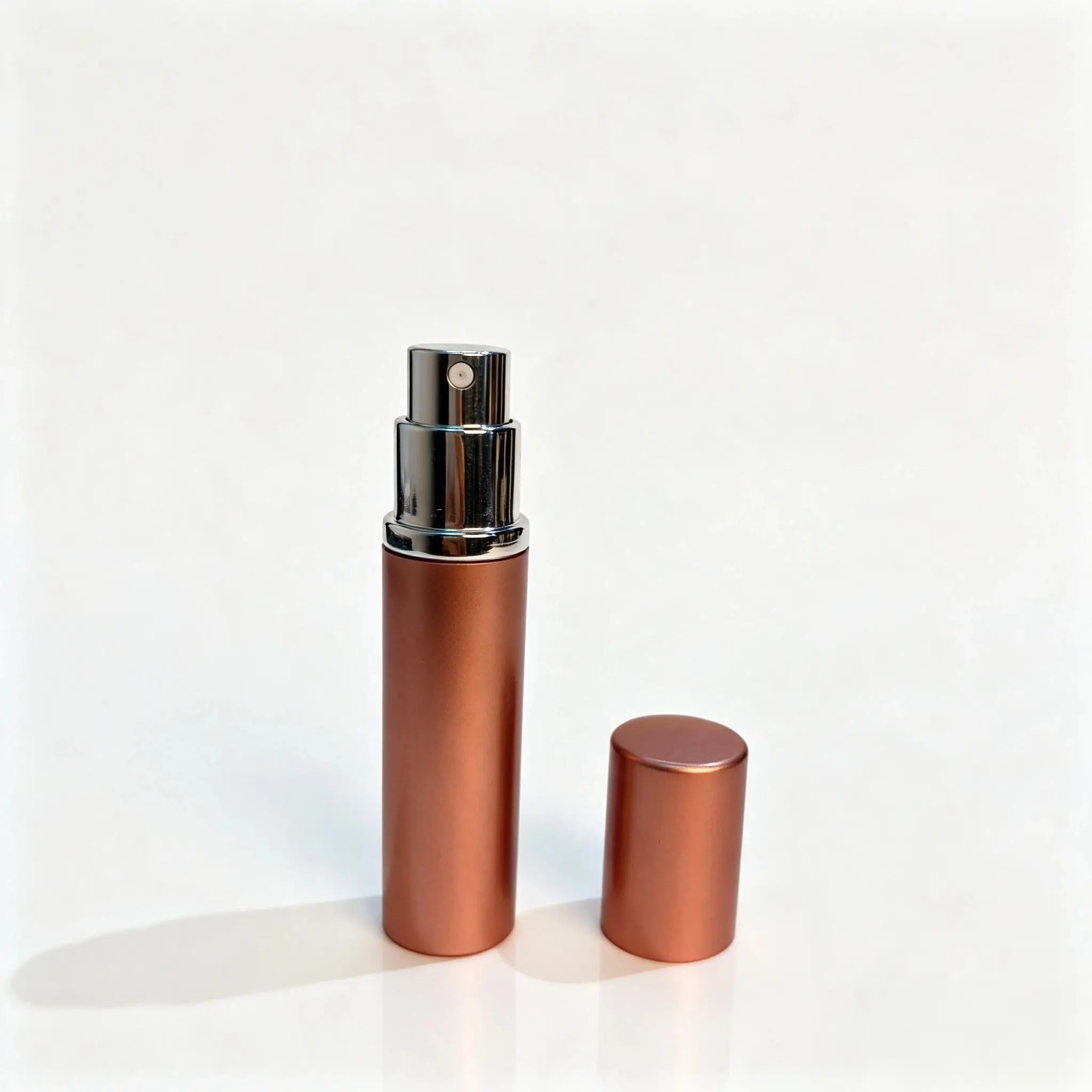 5ml Bottom Fill Perfume Atomizer with Upright Cap 5ml bottom fill reusable perfume atomizer shown with the bottle body and outer cap standing separately beside it