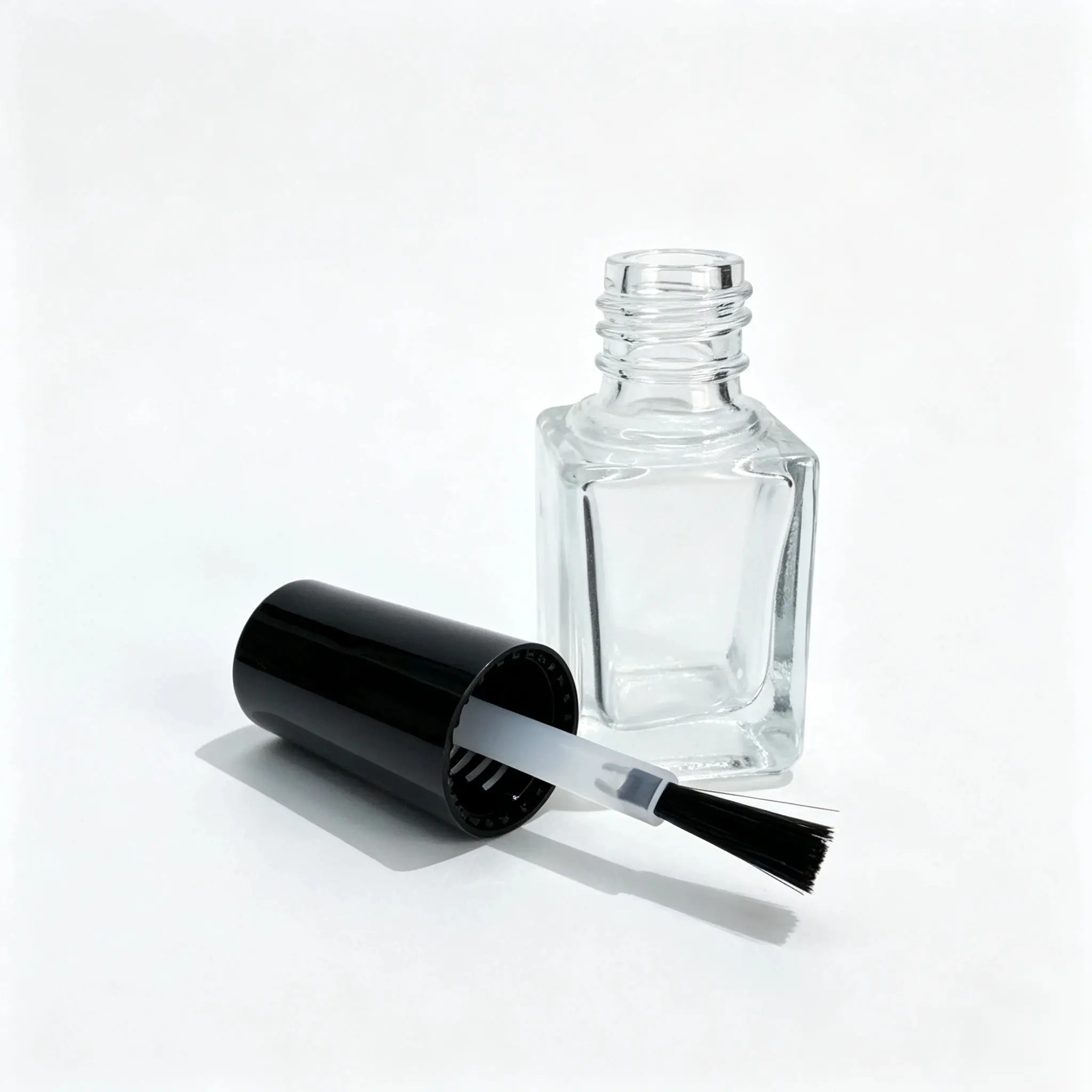 5ml Nail Polish Bottle with Brush and Cap 5ml glass nail polish bottle displayed with its separate brush and cap components