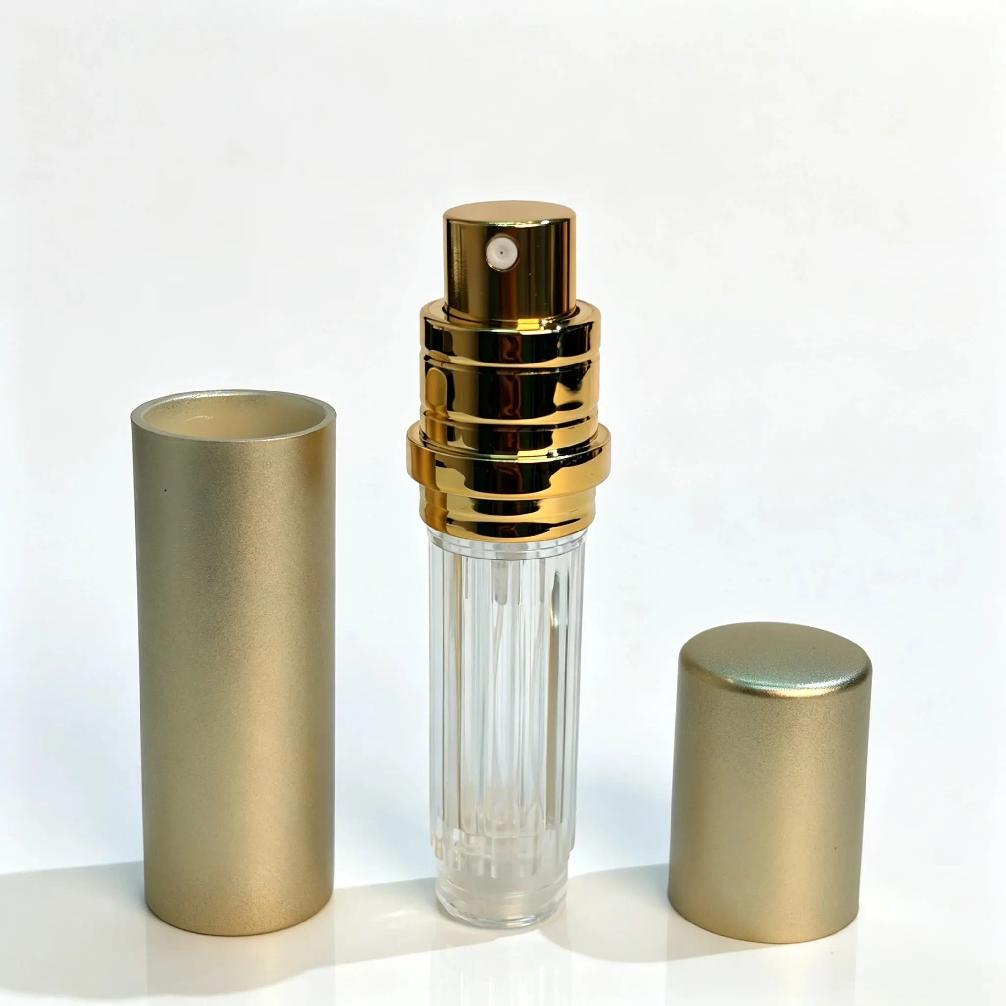 5ml Twist-Up Perfume Atomizer Removable Inner Bottle and Outer Shell 5ml twist-up perfume atomizer shown with removable PCTG inner bottle and ABS outer shell separated for component evaluation