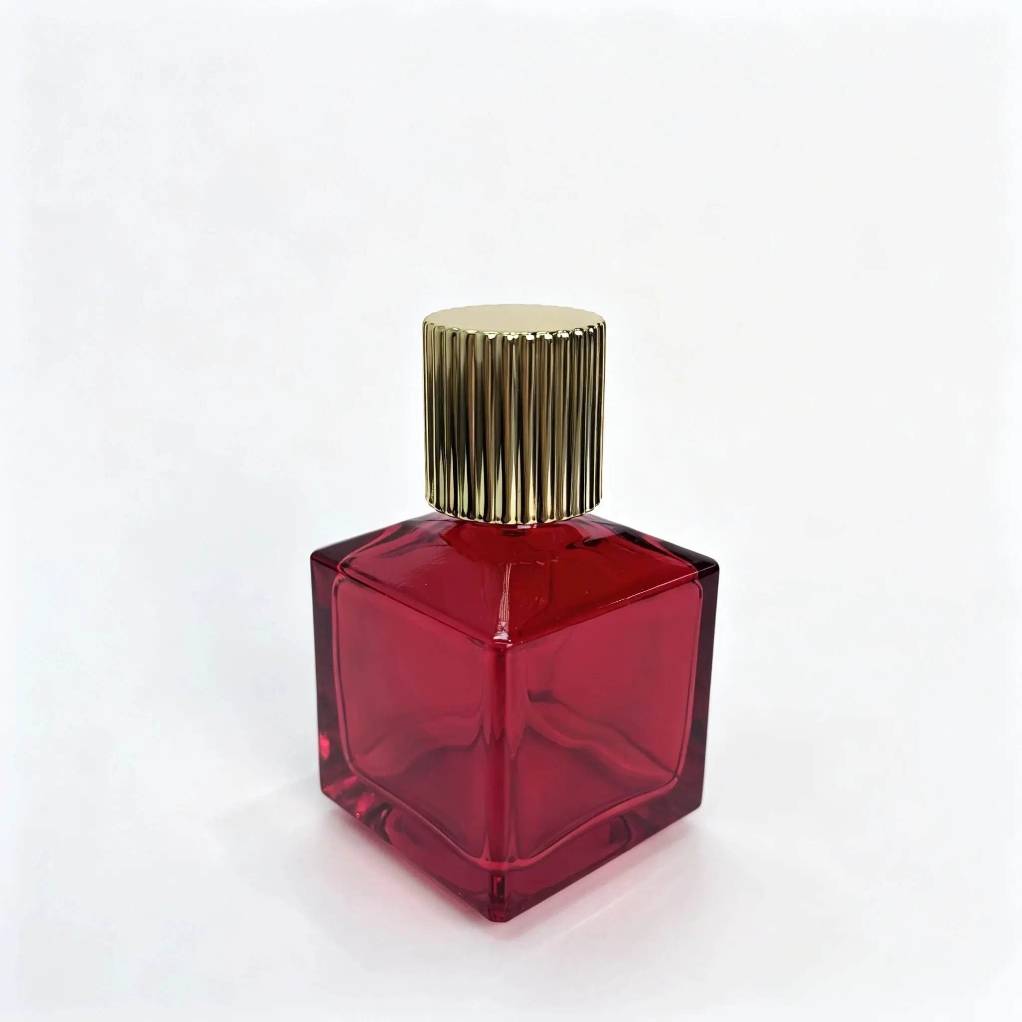 70ml red square glass perfume bottle shown bare from the side to display its compact 55 mm body profile