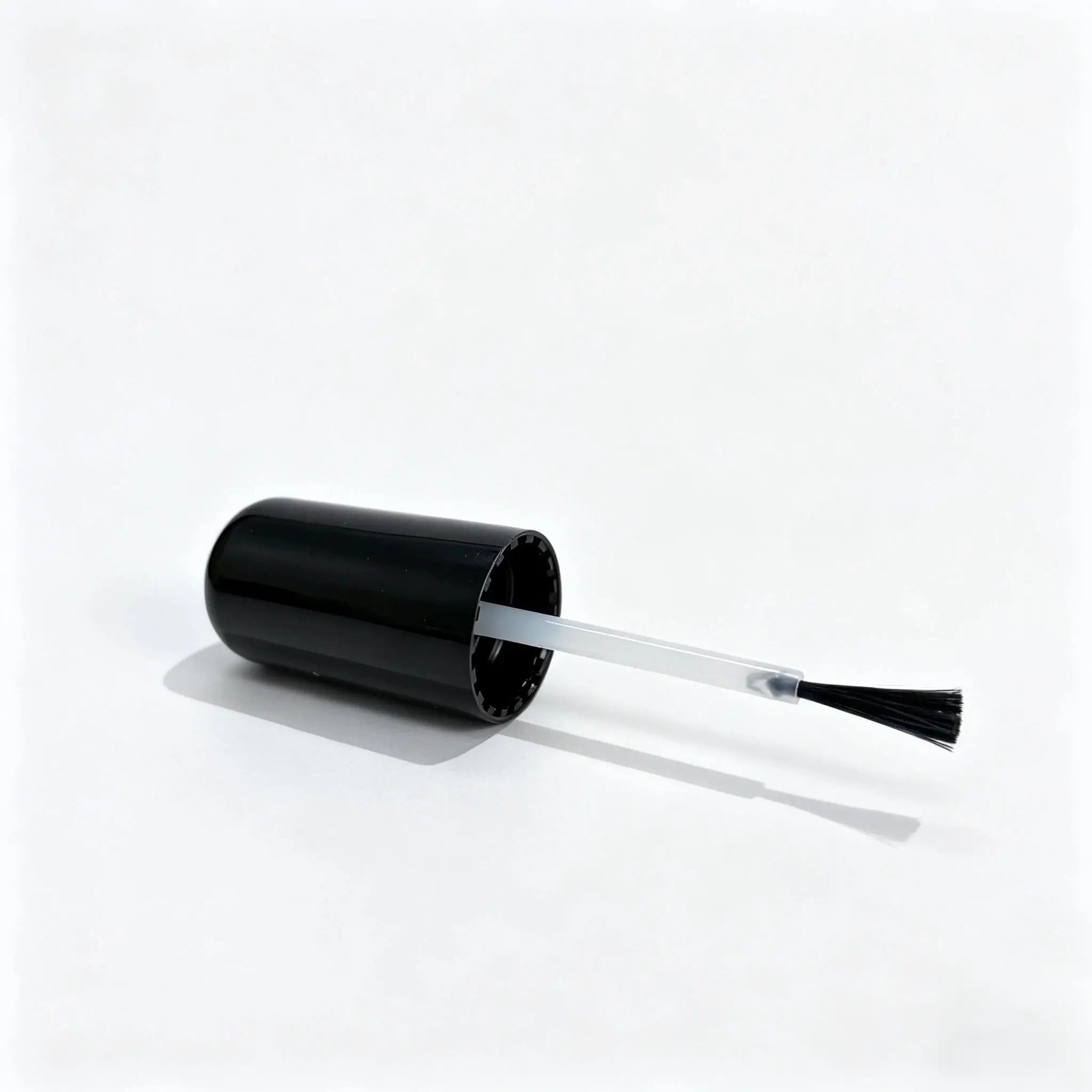75ml Glass Nail Polish Bottle Brush Cap Detail Close view of the black brush cap and applicator assembly for the 75ml glass nail polish bottle.