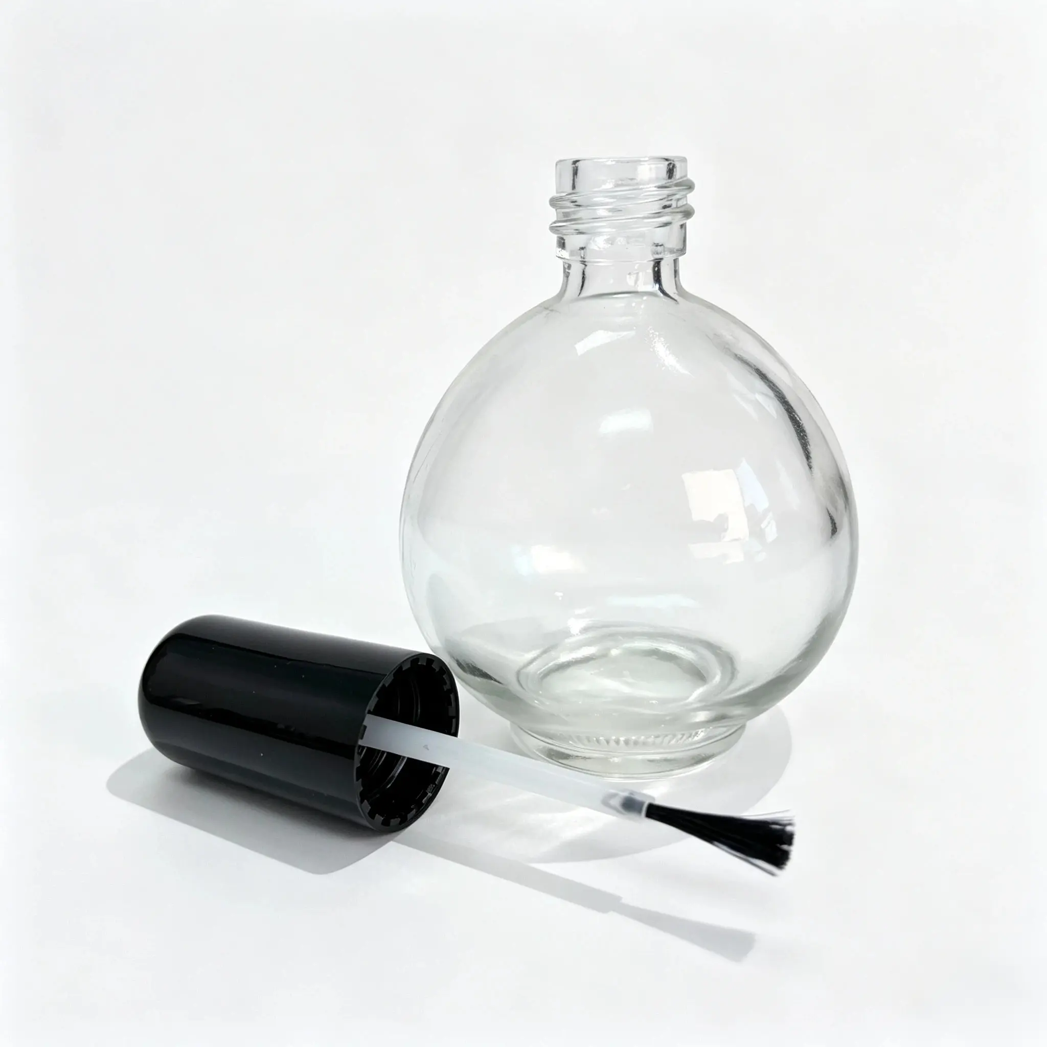 75ml Glass Nail Polish Bottle with Brush and Cap 75ml glass nail polish bottle displayed with separate brush applicator and black cap components for packaging selection.
