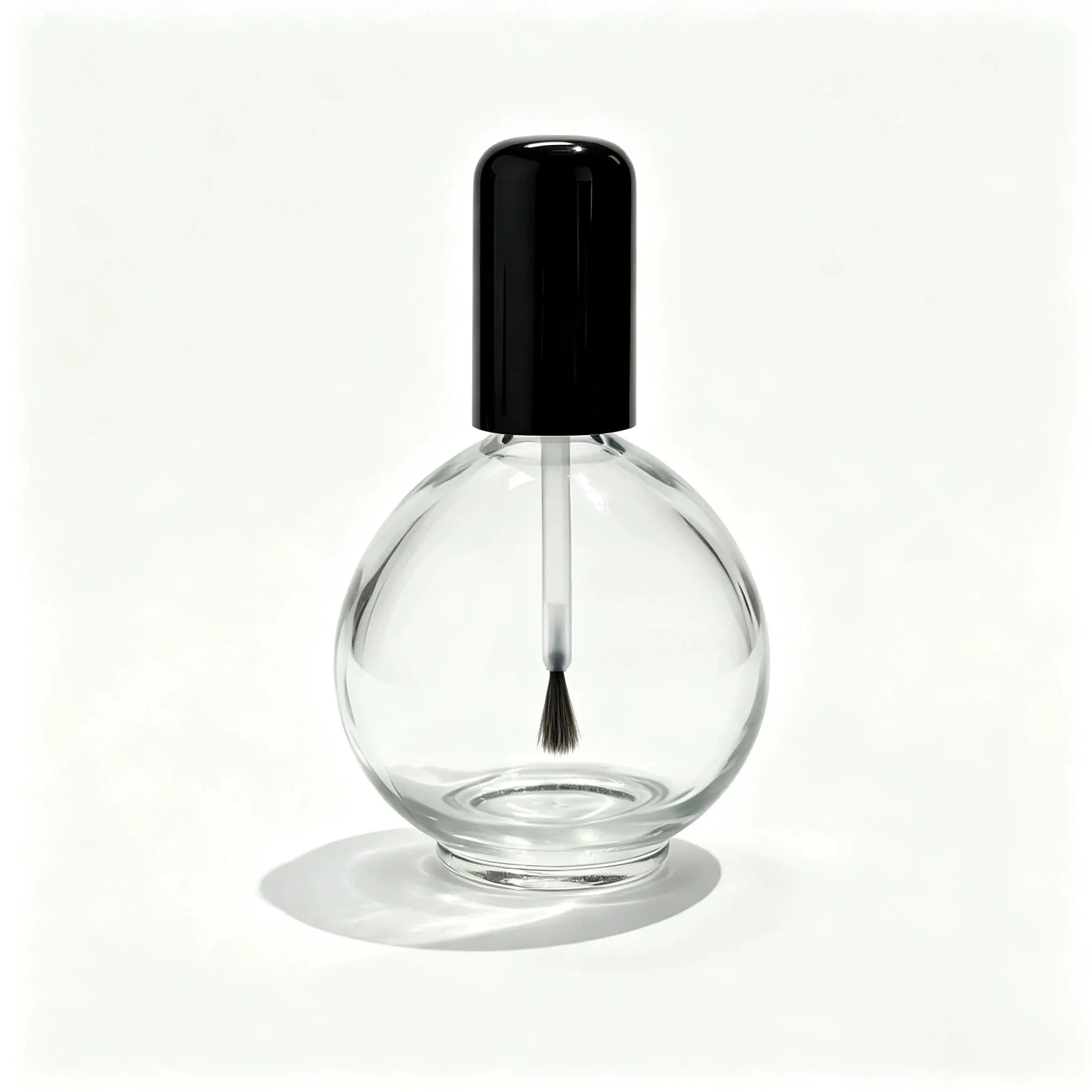 75ml Round Glass Nail Polish Bottle Front View 75ml round glass nail polish bottle shown from the front with a clear rounded body and black brush cap.
