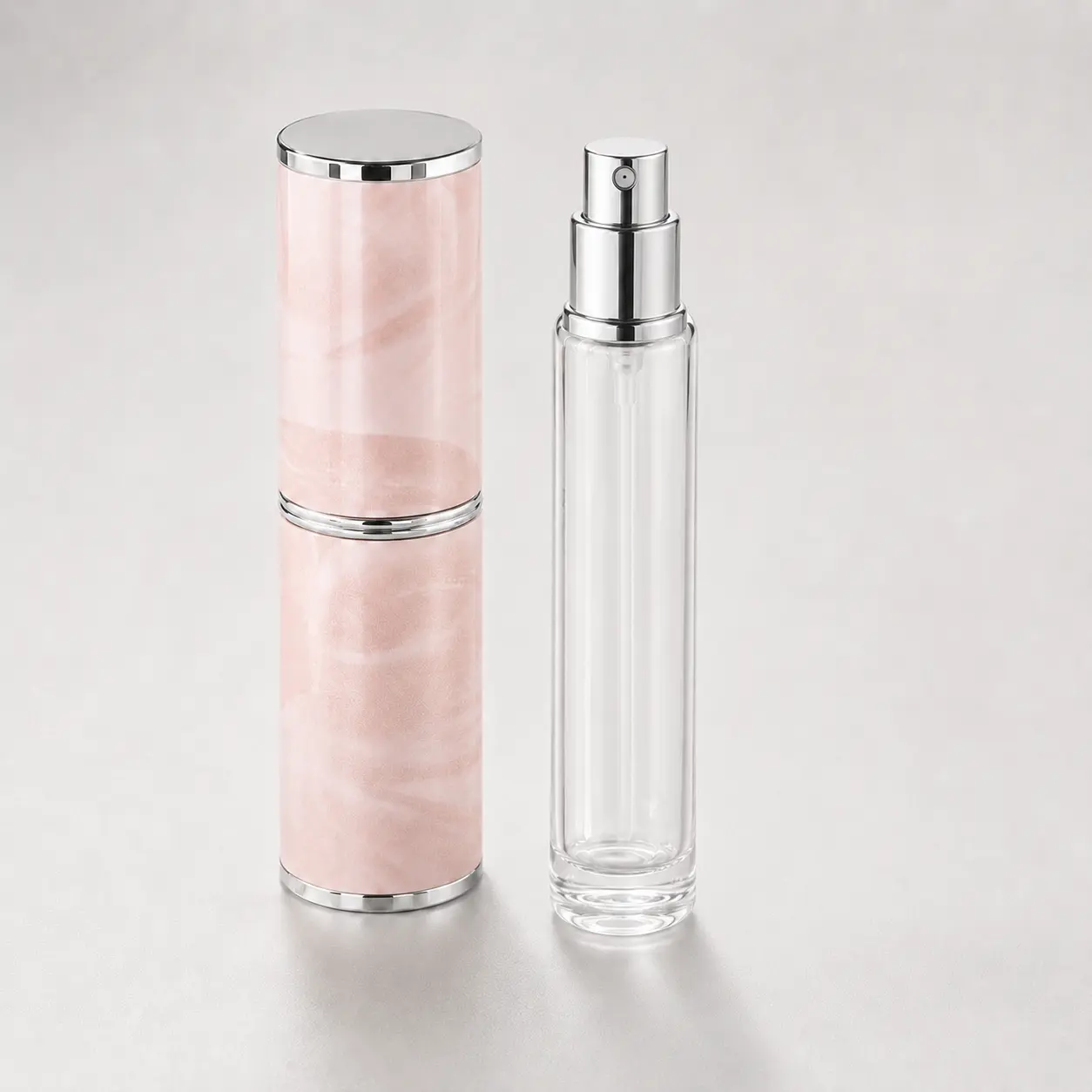 8ml Travel Perfume Atomizer Glass Inner Bottle and Outer Shell 8ml travel perfume atomizer shown with the glass inner bottle and marble-pattern PU outer shell separated for component evaluation