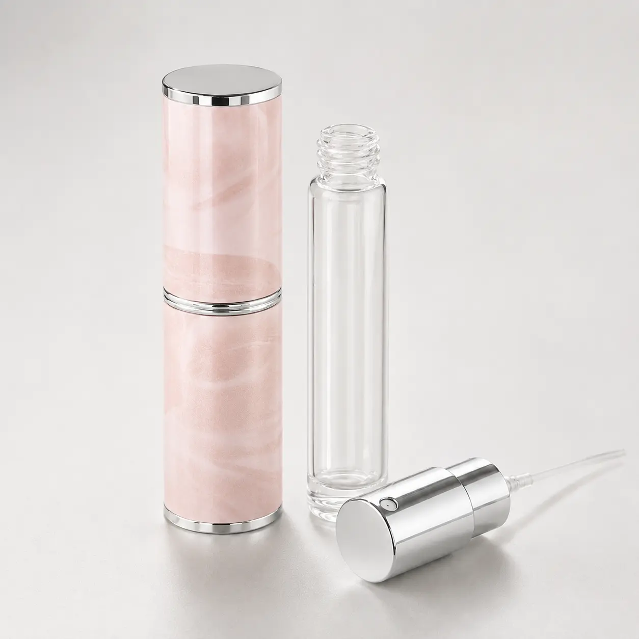 8ml Travel Perfume Atomizer Separate Components and Sprayer 8ml travel perfume atomizer with glass inner bottle PU outer shell and aluminum sprayer displayed as separate components