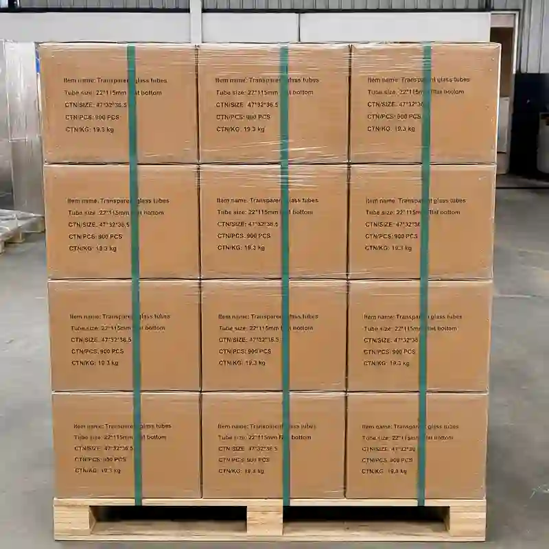 Export cartons securely stacked, strapped and stretch wrapped on a wooden pallet for shipment