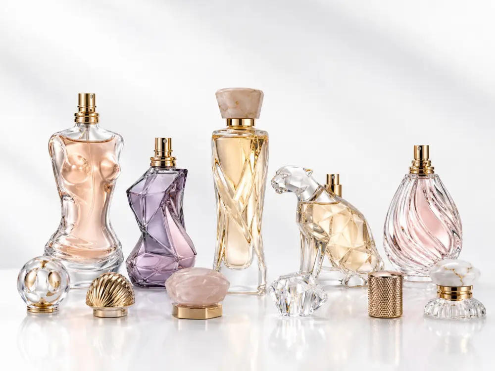 Custom molded glass bottles in human, animal and sculptural shapes with special caps