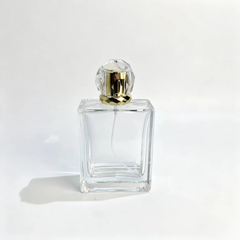 Front view of a 100ml flat rectangular thick-base perfume bottle with its fitted cap, showing the wide bottle body and fragrance packaging design.