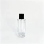 Rear view of the uncapped 100ml fluted perfume bottle highlighting the vertical ribs along the column-shaped bottle body.