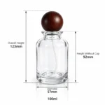Dimension diagram of the 100ml round perfume bottle showing its 57 mm diameter, 123 mm overall height with cap, 92 mm bottle height without cap and 100ml capacity.