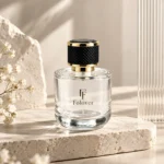 Assembled 100ml short round perfume bottle presented in a fragrance packaging display scene, showing the proportions of its wide body and decorative cap.