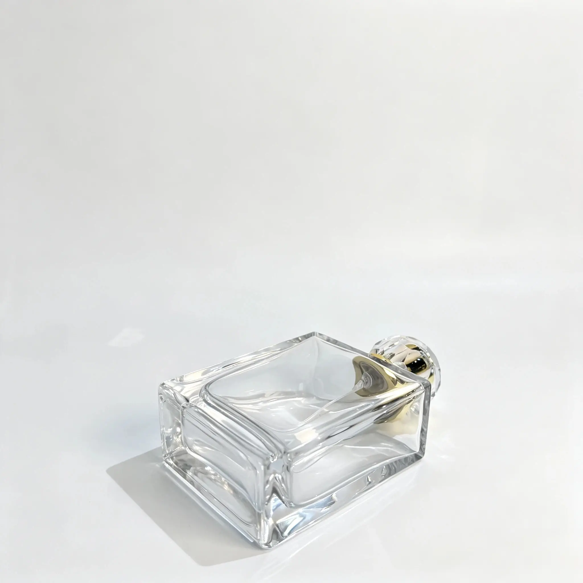 Bottom view of the 100ml rectangular perfume bottle showing its thick-base construction and rectangular bottle profile.