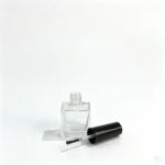 10ml glass nail polish bottle displayed with separate cap and nail polish brush components for packaging evaluation