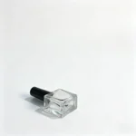 10ml glass nail polish bottle shown from the bottom to display the rectangular glass base structure