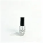 Full view of the 15ml skull-shaped glass nail polish bottle, showing its overall silhouette and cap.