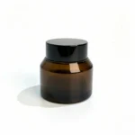 Vista frontal de un 30g tarro de crema de vidrio ámbar con tapa de rosca para crema facial y packaging de cuidado de la piel.