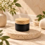 Black glass cream jar with a bamboo lid displayed in a skincare packaging setting, illustrating the 30g cosmetic container format.