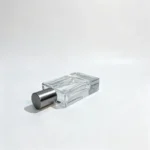 Side-lying view of the 30ml Graphite Minimal perfume bottle showing the fitted cap and the proportions of its slim rectangular body.