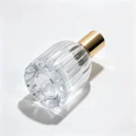 Bottom and side view of the 30ml teardrop perfume bottle in a horizontal position, showing the bottle base and vertical ribbed body structure.