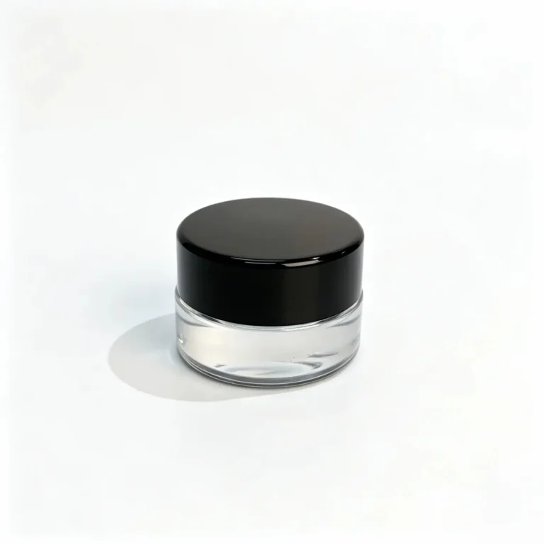Front view of a 3g clear glass cream sample jar with a black screw cap for small-format skincare packaging.