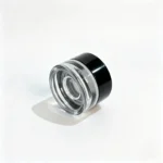 Bottom view of the 3g clear glass cream sample jar showing the glass base and its compact container structure.