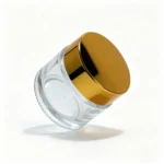 Side view of the 50g clear cream jar showing its transparent body and gold screw lid with a 45 mm overall height