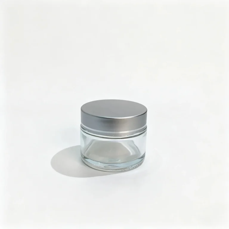 50g clear glass cream jar shown from the front with its assembled silver screw lid