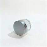 Side view of the 50g clear glass cream jar showing its 45 mm assembled height and silver screw lid