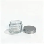 50g glass cream jar displayed with a pull-tab inner lid and separate silver screw cap for skincare packaging